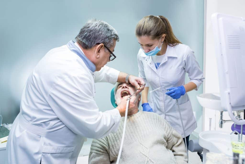 Dentist and assistant working